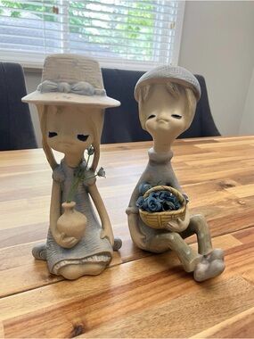 vintage UCTCI Japan Long-Neck Pixie Girl and boy figurines from the 1970s.